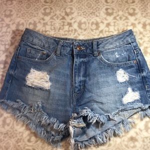 Blue jean high waisted distressed shorts.
